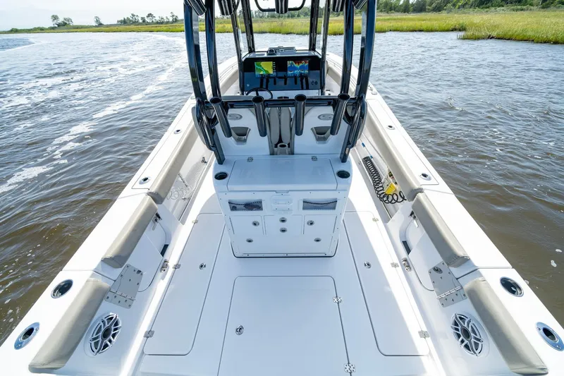  Yacht Photos Pics 2023 Sportsman Open 282 Center Console boat on water, showcasing spacious deck and seating.