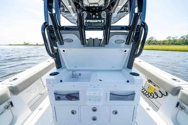  Yacht Photos Pics 2023 Sportsman Open 282 Center Console boat interior with fishing rod holders and storage.