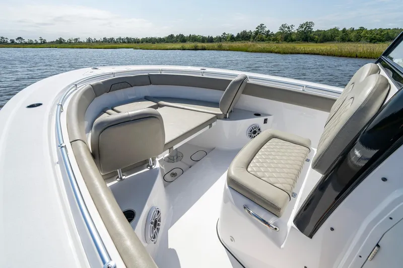  Yacht Photos Pics 2023 Sportsman Open 282 Center Console boat interior with cushioned seating and water view.