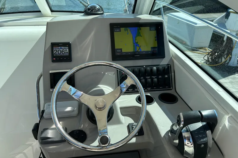  Yacht Photos Pics Helm of 2015 Boston Whaler 285 Conquest with navigation and control systems.