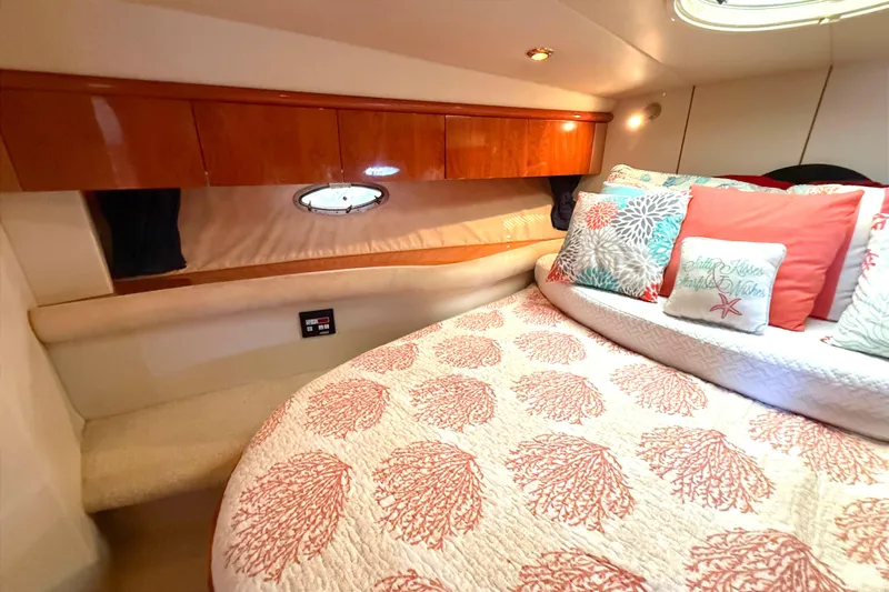  Yacht Photos Pics Luxurious cabin interior of 2002 Sunseeker Camargue 44 yacht with elegant bedding and cushions.