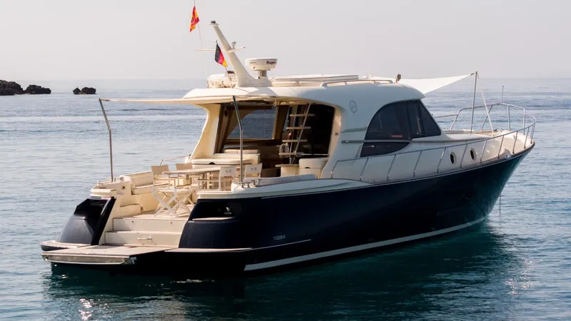 Tati Blue Yacht Photos Pics Luxury 2010 Mochi Craft 54 yacht on calm sea, rear view.