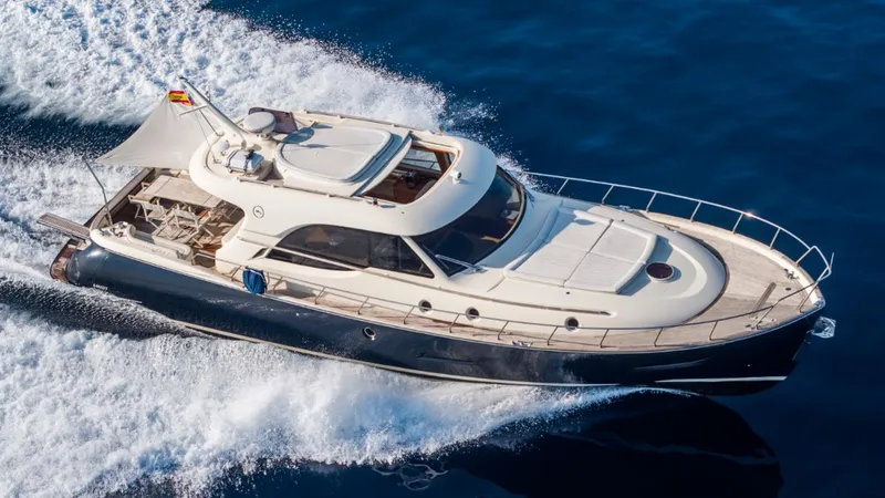 Tati Blue Yacht Photos Pics Luxurious 2010 Mochi Craft 54 yacht cruising on open water.