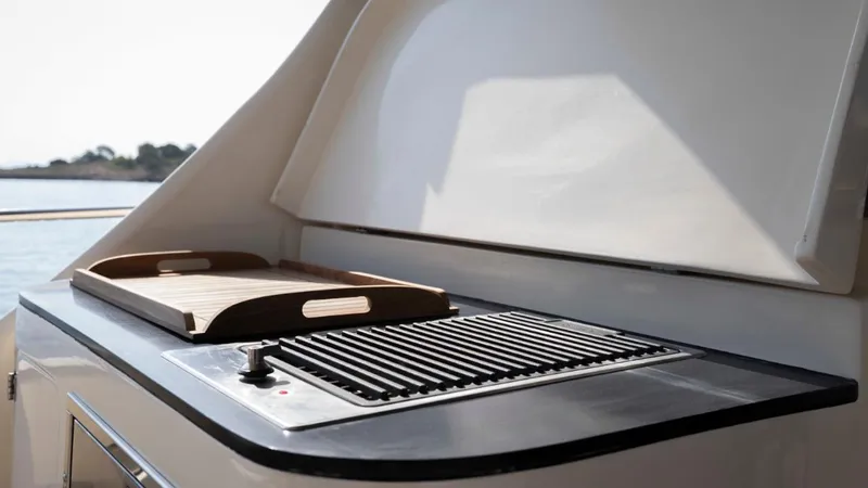 Tati Blue Yacht Photos Pics Outdoor grill and tray on 2010 Mochi Craft 54 yacht deck.