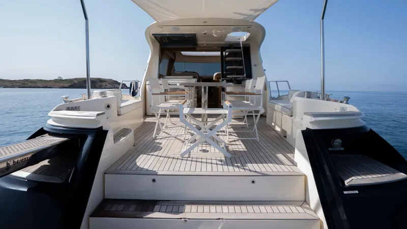 Tati Blue Yacht Photos Pics Luxury Mochi Craft 54 yacht deck, 2010 model, with elegant seating and ocean view.