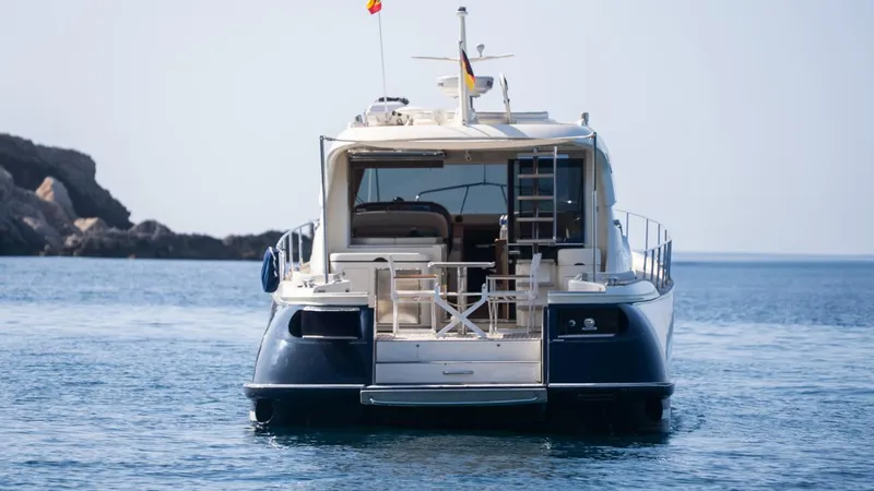 Tati Blue Yacht Photos Pics 2010 Mochi Craft 54 yacht on calm sea, rear view.