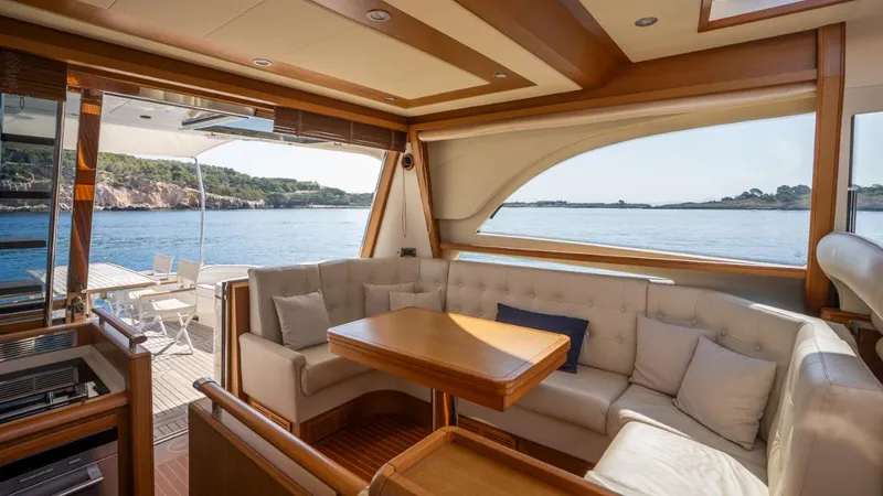 Tati Blue Yacht Photos Pics Luxurious interior of 2010 Mochi Craft 54 yacht with scenic ocean view.