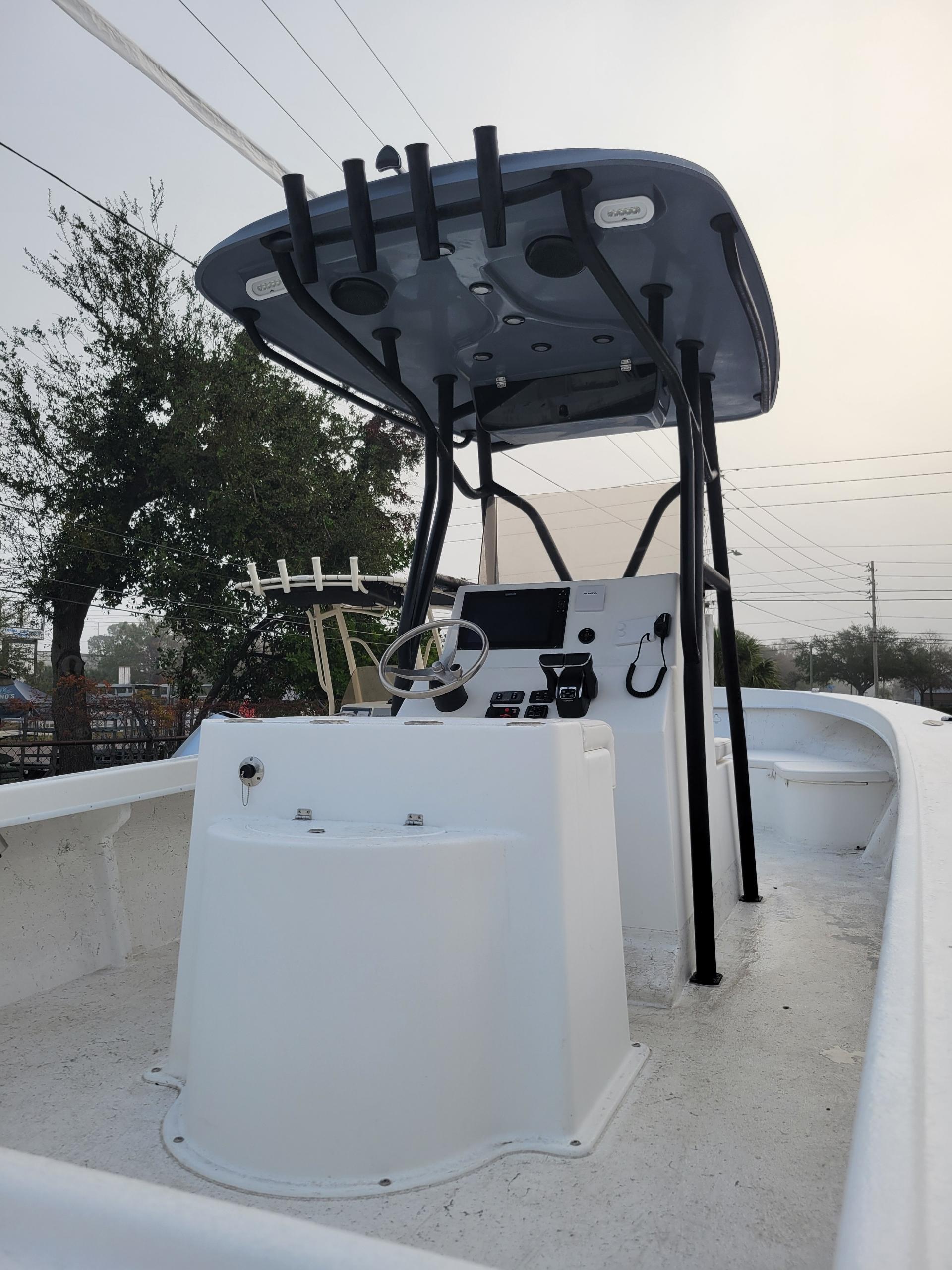 2025 C-Hawk 29 Center Console boat with modern helm and T-top design.
