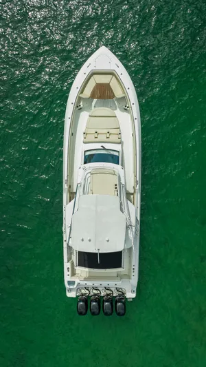  Yacht Photos Pics Aerial view of 2016 Boston Whaler 420 Outrage boat on green water.