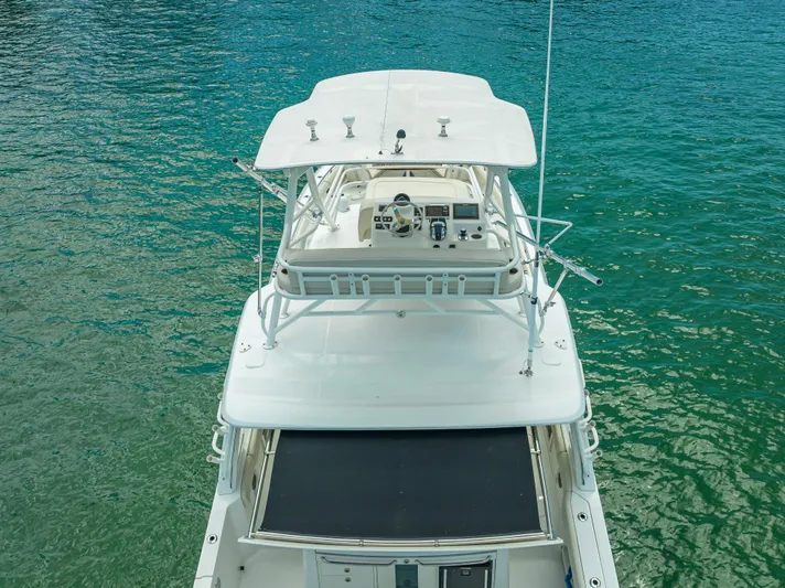  Yacht Photos Pics 2016 Boston Whaler 420 Outrage boat on clear turquoise water, aerial view.