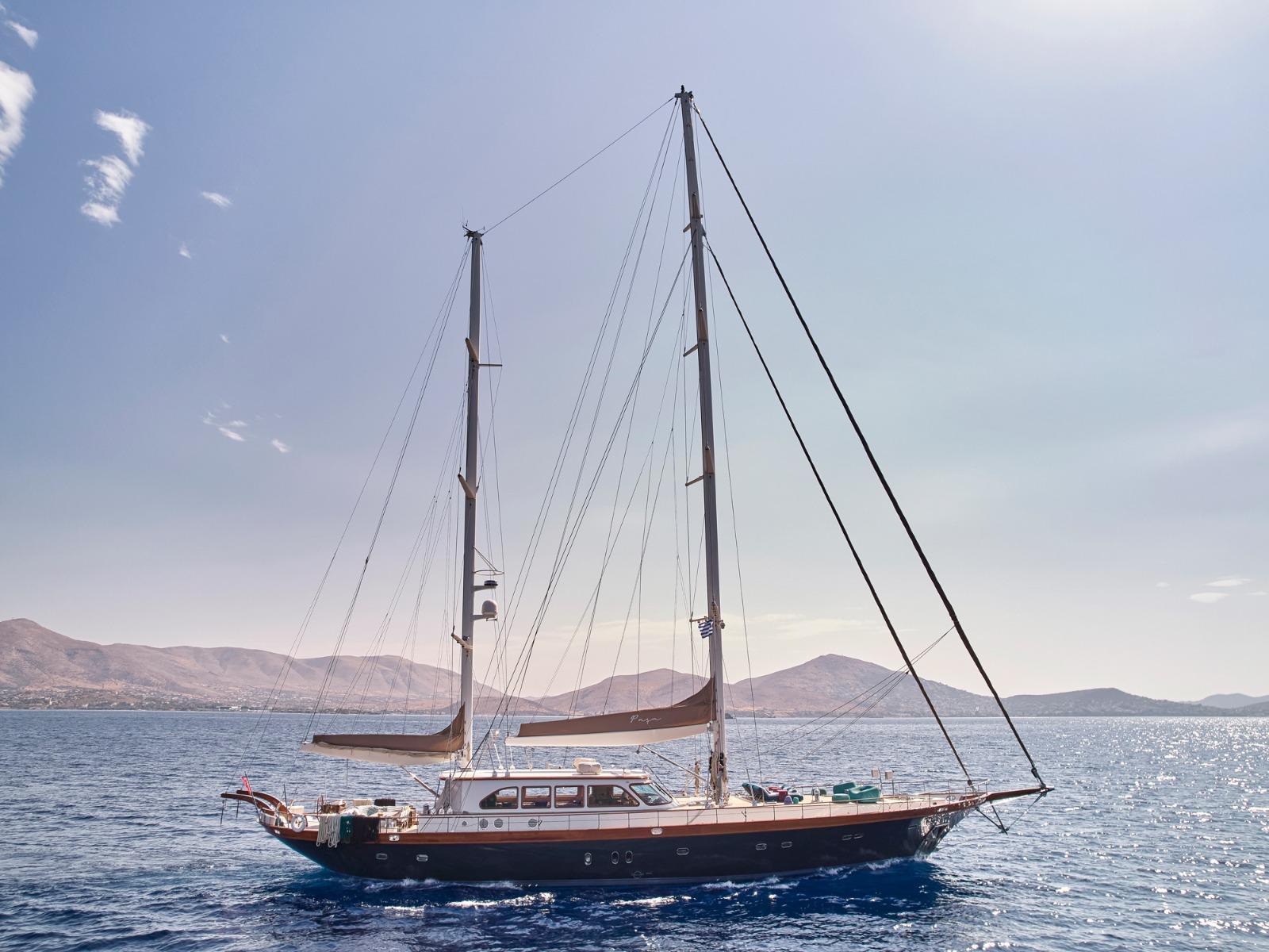 Sailing yacht on open sea with mountainous background, custom model, 2009.