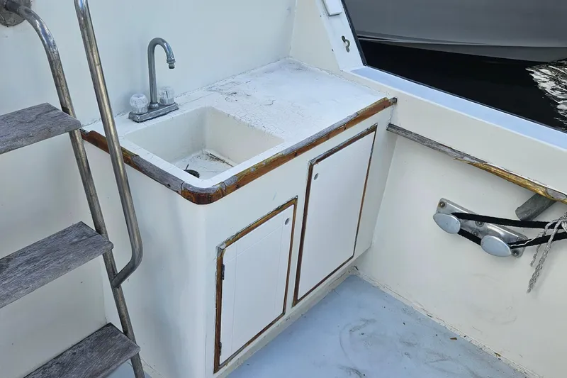  Yacht Photos Pics Cockpit sink and storage on 1988 Cheoy Lee 51 Long Range Motor Yacht.