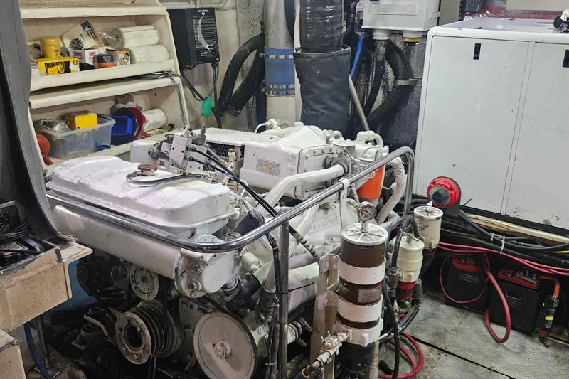  Yacht Photos Pics Engine room of 1988 Cheoy Lee 51 Long Range Cockpit Motor Yacht, showcasing machinery and equipment.