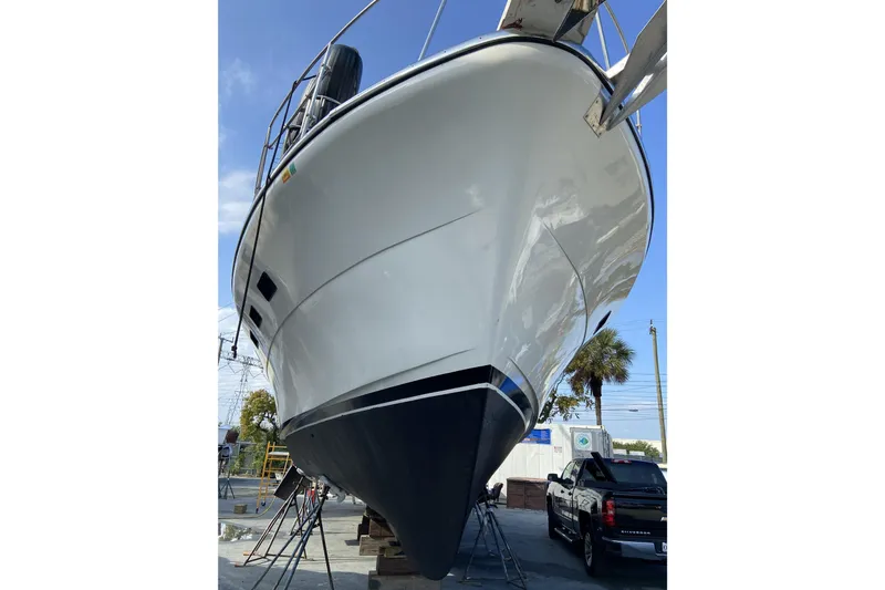  Yacht Photos Pics 1988 Cheoy Lee 51 Long Range Cockpit Motor Yacht on dry dock, side view.