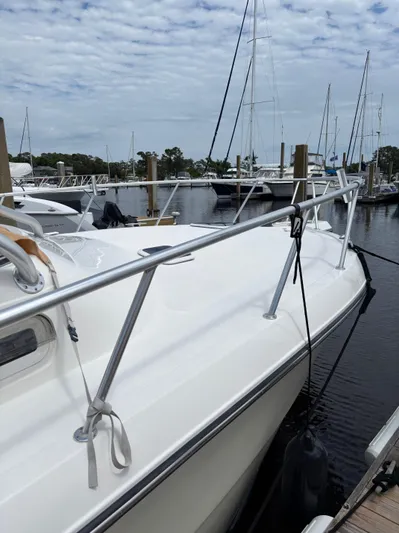  Yacht Photos Pics 2006 Rampage 38 Express boat docked at a marina under a cloudy sky.