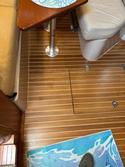  Yacht Photos Pics 2006 Rampage 38 Express interior with wooden flooring and seating area.