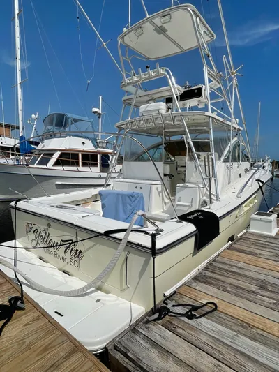  Yacht Photos Pics 2006 Rampage 38 Express boat docked at marina under clear blue sky.