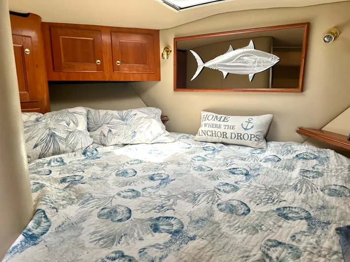  Yacht Photos Pics Cozy cabin interior of 2006 Rampage 38 Express with nautical decor and wooden cabinets.