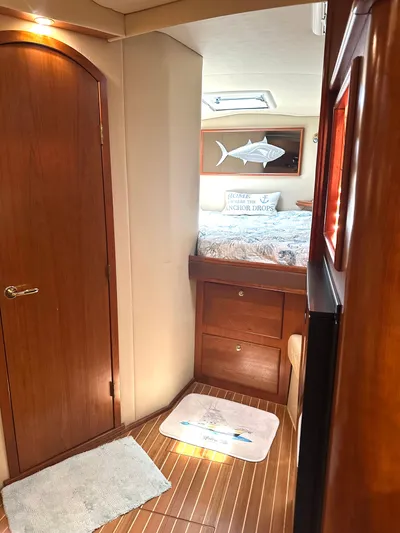  Yacht Photos Pics Interior of 2006 Rampage 38 Express yacht with wooden flooring and cozy bedroom.