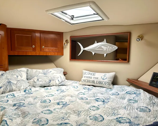  Yacht Photos Pics Cozy cabin interior of 2006 Rampage 38 Express with nautical decor and skylight.