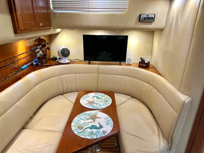  Yacht Photos Pics Luxurious 2006 Rampage 38 Express yacht interior with cozy seating and elegant decor.