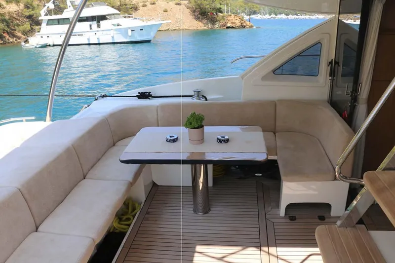  Yacht Photos Pics Luxurious seating area on 2015 Absolute 56 FLY yacht with scenic water view.