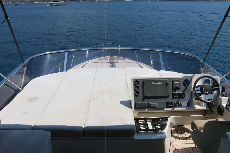  Yacht Photos Pics Flybridge view of 2015 Absolute 56 FLY yacht with helm and seating area.