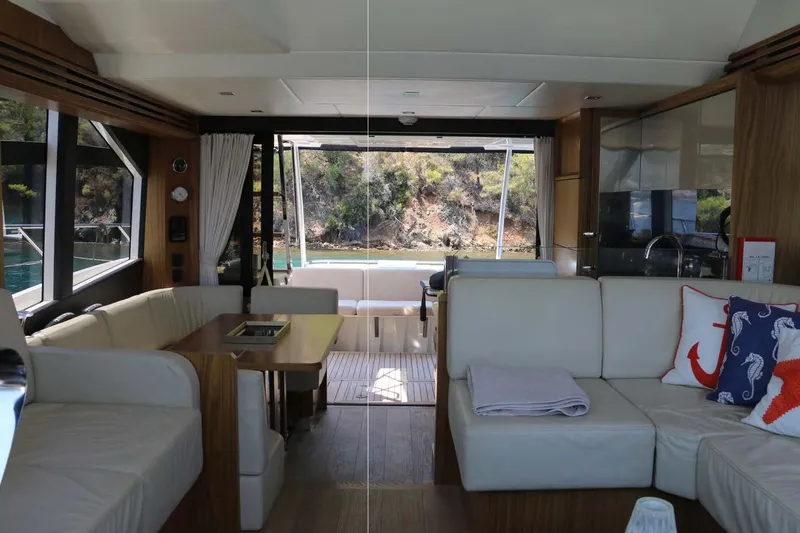  Yacht Photos Pics Luxurious interior of 2015 Absolute 56 FLY yacht with elegant seating and scenic view.