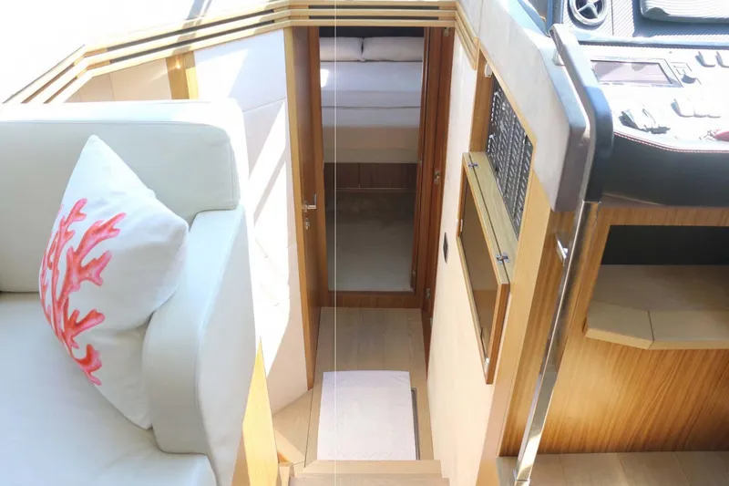  Yacht Photos Pics Interior of 2015 Absolute 56 FLY yacht with modern design and coral-themed decor.