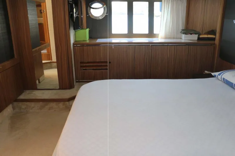  Yacht Photos Pics Luxurious cabin interior of 2015 Absolute 56 FLY yacht with wood finishes.