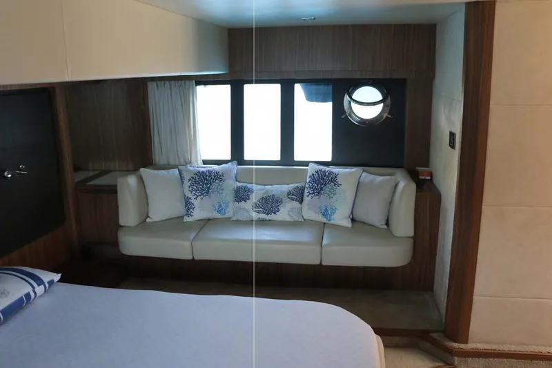  Yacht Photos Pics Luxurious interior of 2015 Absolute 56 FLY yacht with elegant seating and decorative pillows.