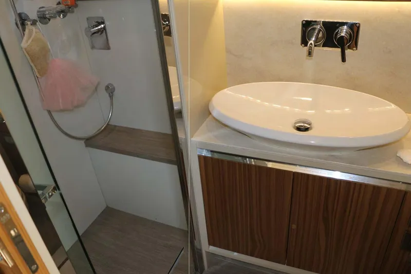  Yacht Photos Pics Bathroom interior of 2015 Absolute 56 FLY yacht with modern sink and shower.