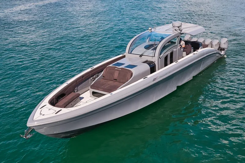  Yacht Photos Pics Luxury Midnight Express 52' Vitesse yacht cruising on clear blue water.