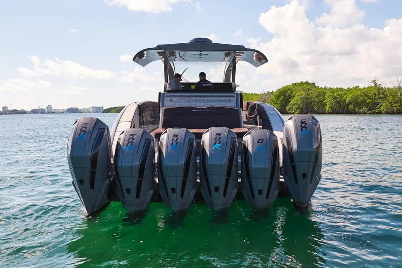  Yacht Photos Pics Midnight Express 52' Vitesse boat with six powerful outboard engines on a sunny day.