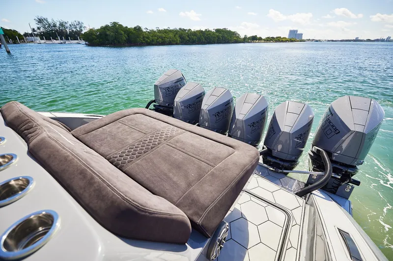  Yacht Photos Pics Luxury Midnight Express 52' Vitesse boat with five powerful outboard engines on a sunny day.