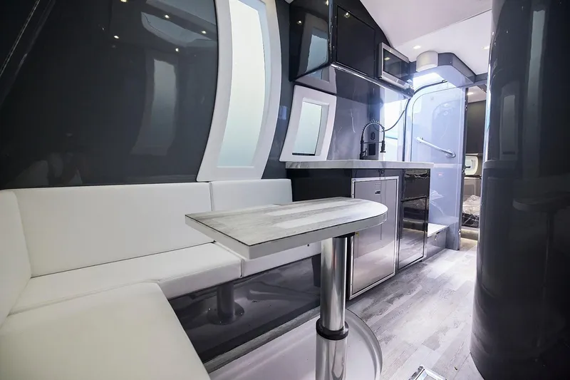  Yacht Photos Pics Luxurious interior of Midnight Express 52' Vitesse yacht with modern seating and kitchenette.