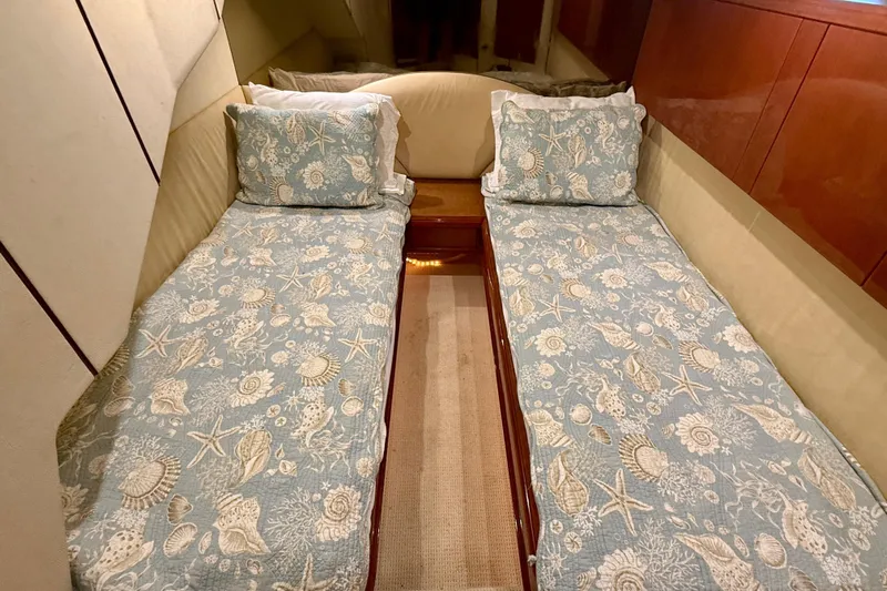  Yacht Photos Pics Twin beds with seashell-patterned bedding in a 2000 Fairline Squadron 55 yacht cabin.