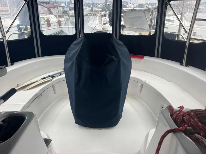 "helluva" Yacht Photos Pics Interior view of a 2000 Hunter 410 sailboat cockpit with covered steering wheel.