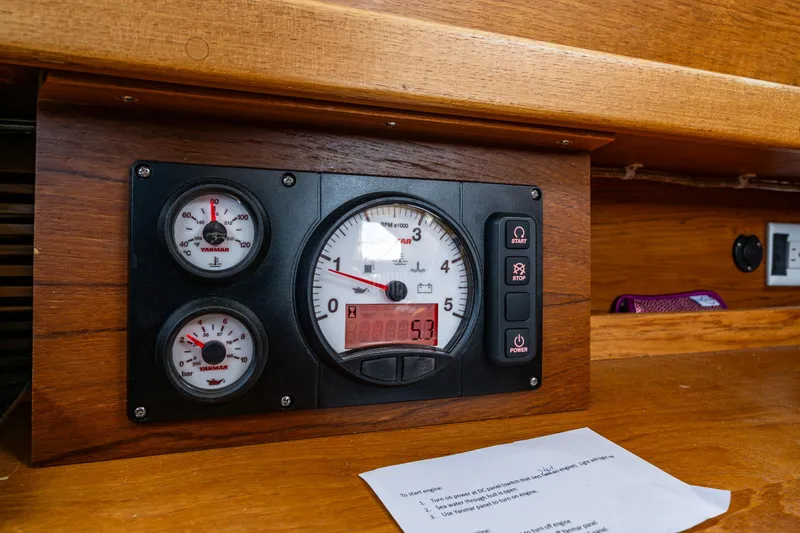 Emeritus Yacht Photos Pics Instrument panel of a 2000 Nauticat 35 Pilot House sailboat, featuring gauges and controls.