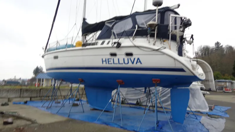 "helluva" Yacht Photos Pics Hunter 410 sailboat named "Helluva" on stands, 2000 model, in a boatyard.