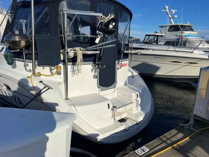 "helluva" Yacht Photos Pics Hunter 410 sailboat from 2000 docked at marina, with clear blue sky.