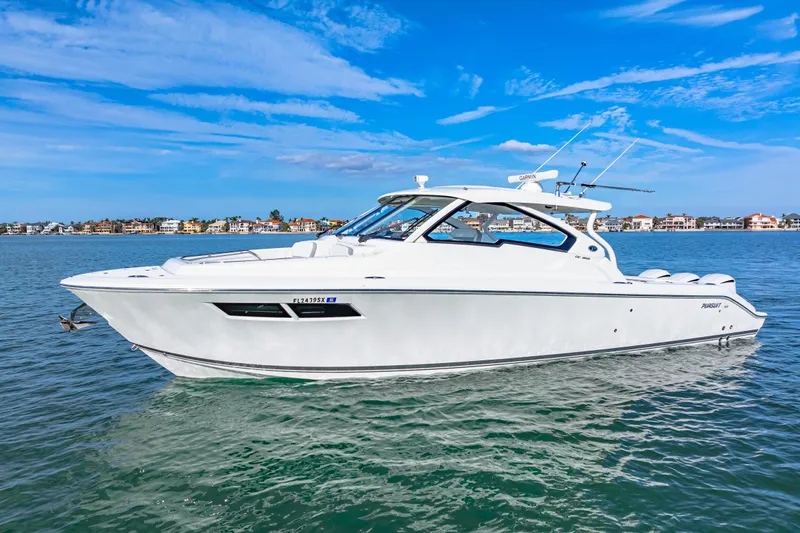 Conspirasea Yacht Photos Pics 2021 Pursuit DC 365 Dual Console boat on calm water, clear blue sky.