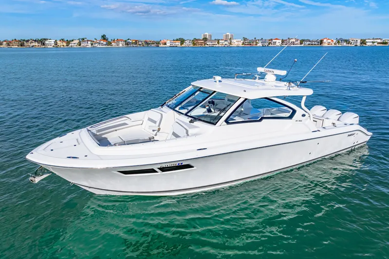 Conspirasea Yacht Photos Pics 2021 Pursuit DC 365 Dual Console boat on clear blue water.