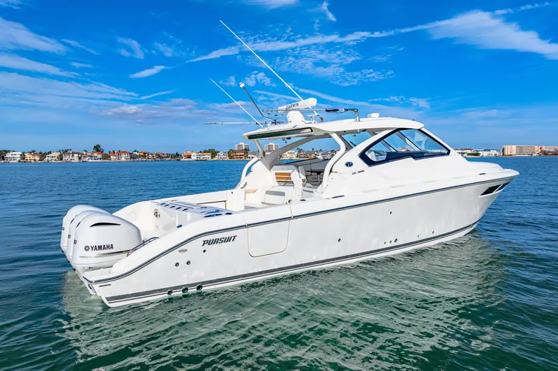 Conspirasea Yacht Photos Pics 2021 Pursuit DC 365 Dual Console boat on calm water under blue sky.
