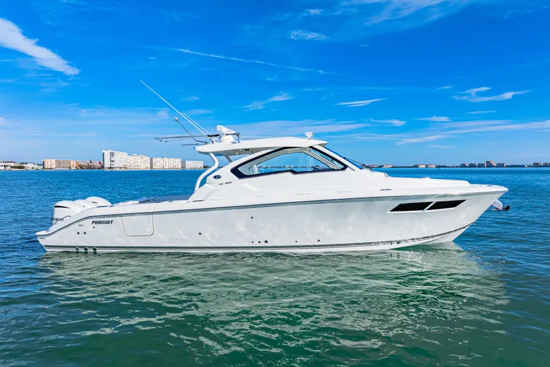 Conspirasea Yacht Photos Pics 2021 Pursuit DC 365 Dual Console boat on clear blue water.