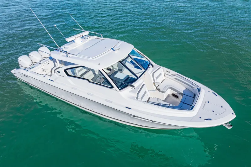 Conspirasea Yacht Photos Pics 2021 Pursuit DC 365 Dual Console boat on clear blue water.