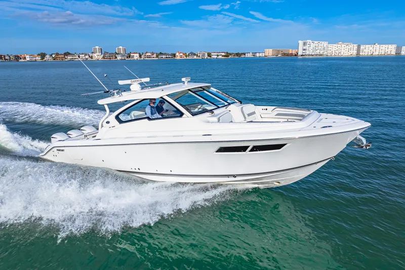 Conspirasea Yacht Photos Pics 2021 Pursuit DC 365 Dual Console boat cruising on open water.