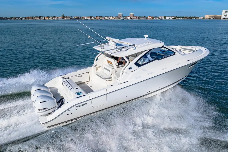 Conspirasea Yacht Photos Pics 2021 Pursuit DC 365 Dual Console boat cruising on open water, showcasing sleek design and powerful engines.