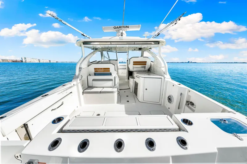 Conspirasea Yacht Photos Pics 2021 Pursuit DC 365 Dual Console boat on clear blue water.