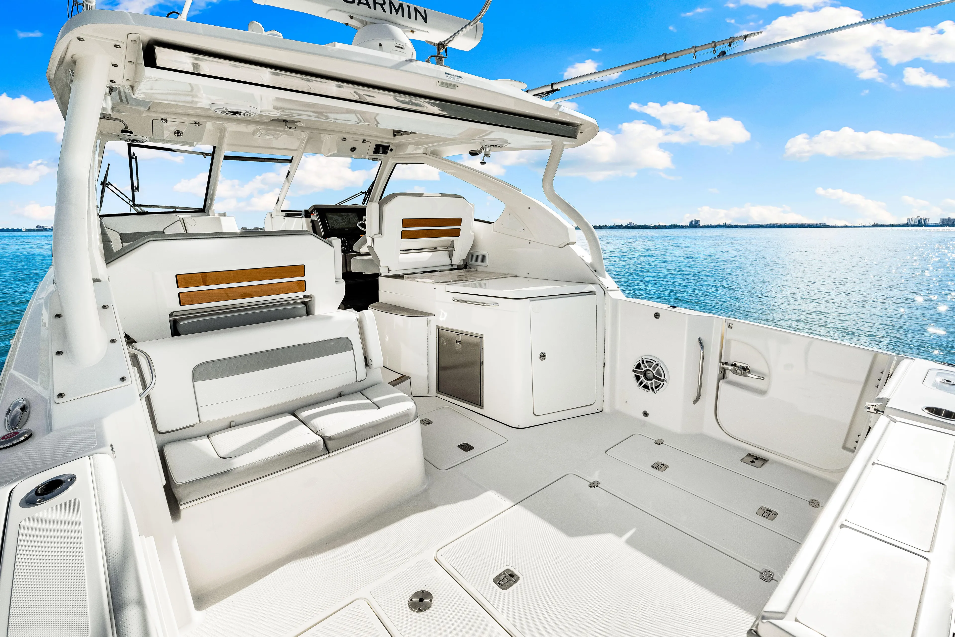 Conspirasea Yacht Photos Pics 2021 Pursuit DC 365 Dual Console boat interior on a sunny day at sea.